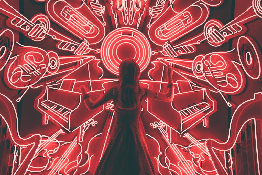 New York City window display picture a woman standing in front of neon outlines of jazz instruments, as if conducting an orchestra.